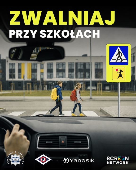 Kierujący samochodem przed przejściem dla pieszych, którym przechodzą dzieci.